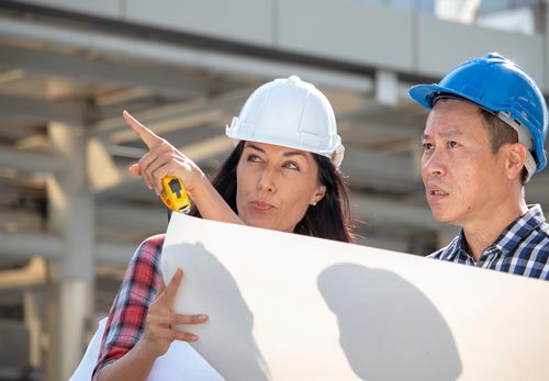 engineer-woman-is-pointing-for-project-manager-to-see-building_t20_axQ2rp.jpg